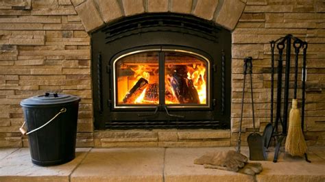 burning wood on a gas fireplace